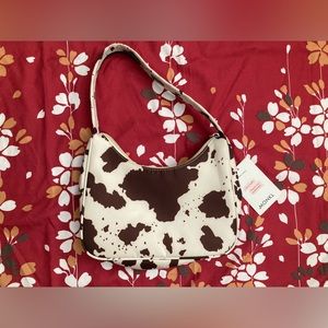 Monki Hilma recycled shoulder bag in cow print